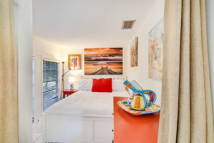 Bedroom with a double bed at entrance overlooks the private huge front yard.