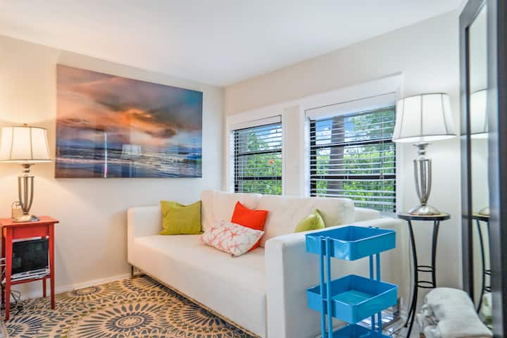 Den overlooks the private front yard. This couch opens up to a double bed. The mattress is between a full size and a queen.