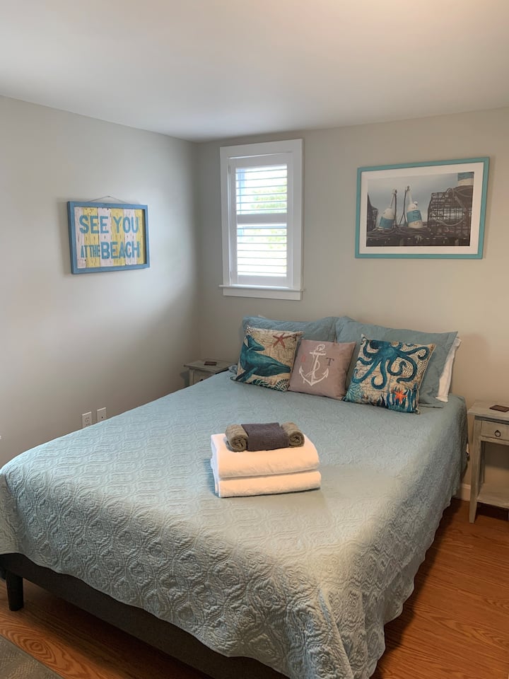 Largest bedroom features a Queen sized bed, dresser and large closet for all your storage needs. Room also has a smart TV, and futon for additional sleeping and/or relaxing.