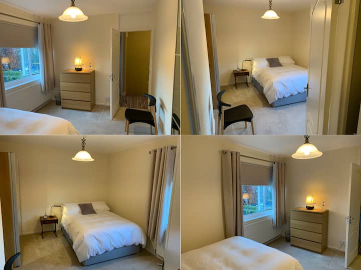Quiet double-bedroom with comfortable double bed, large wardrobe, chest of drawers, chair, reading light on bed side table, alarm clock, view to green garden. Bedroom is just next to the bathroom and toilet on the first floor.