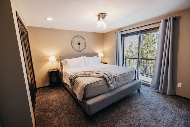 Upstairs guestroom with a king size bed and its own balcony!