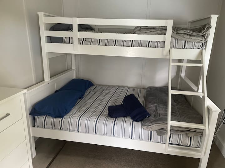 Second bedroom with double bed and single bunk.