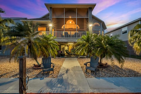 Waterfront luxury beach house dock kayaks games