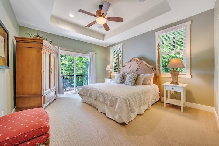 Main floor master bedroom with King bed and its own private balcony, attached bathroom  with soaking tub and walk in closet.