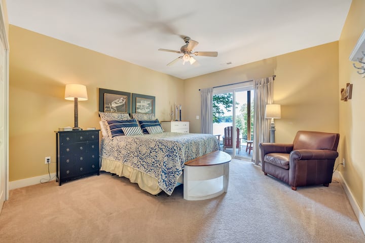 Downstairs queen bedroom with comfy seating and deck access!