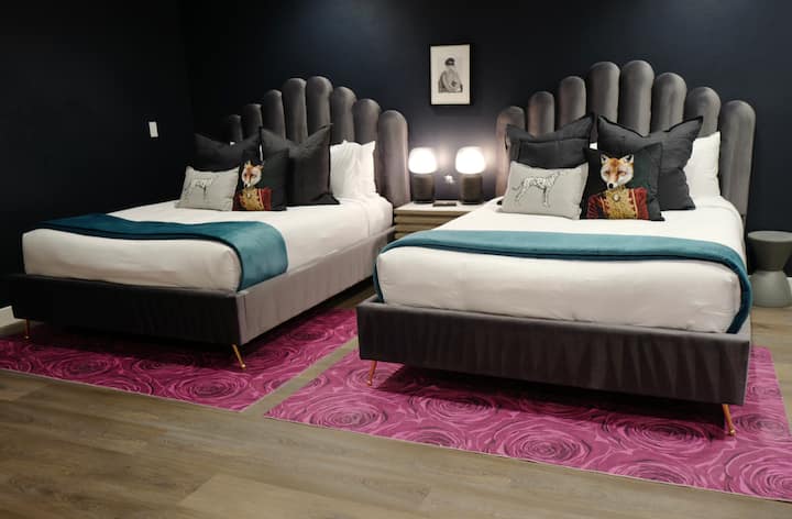 Bed #4 has 2 queen beds, wardrobe closets, flatscreen tv, dresser and attached bathroom