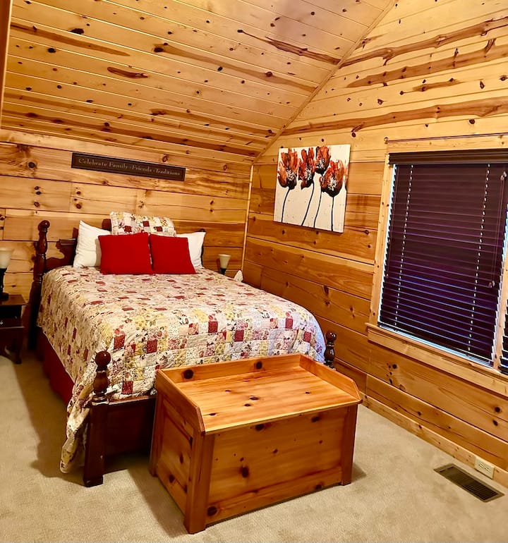 Upstairs bedroom with cozy queen bed shares a bath with the room next door.
