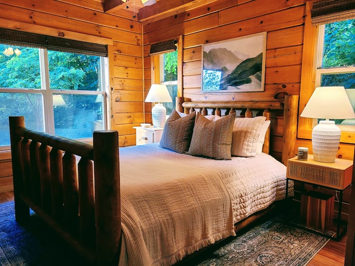 Main level bedroom with a queen bed and memory foam mattress.