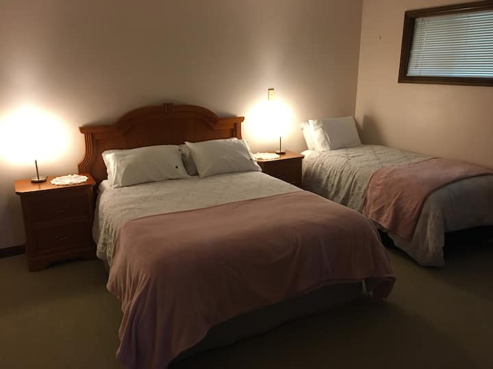 The first (Main)Bedroom offers a Queen bed and single bed with ample space.