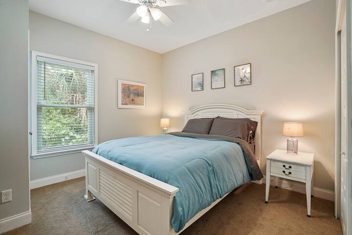 Queen bed with two end tables and two large closets. Iron, ironing board, and hair dryer are included. 