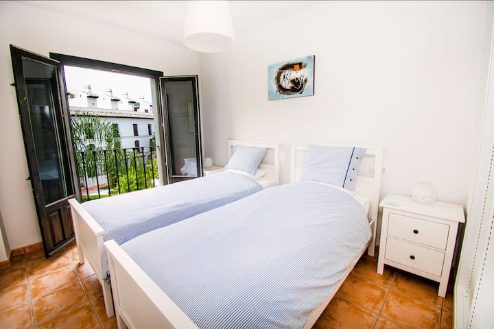 The second bedroom also overlooks the gardens and pool. 

"Enjoy the pool view and the lovely gardens"