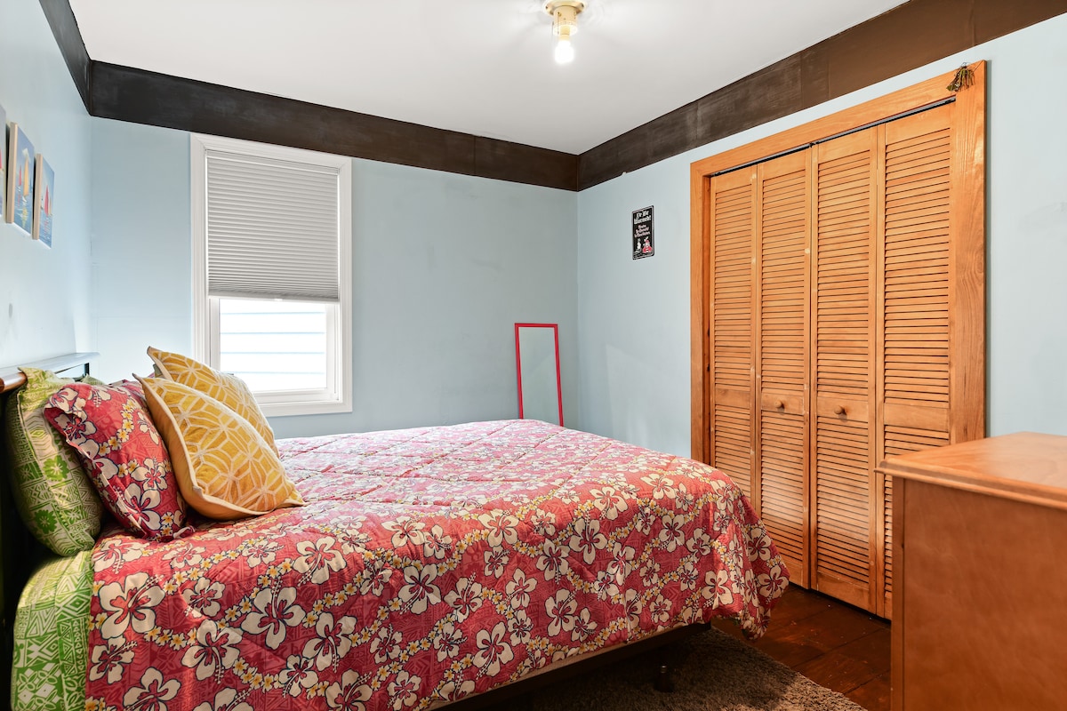 Full bed, downstairs bedroom across from bathroom.