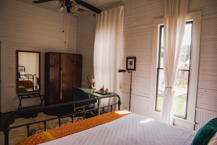 View from bed in Christopher Suite. Desk. And Armoire. 