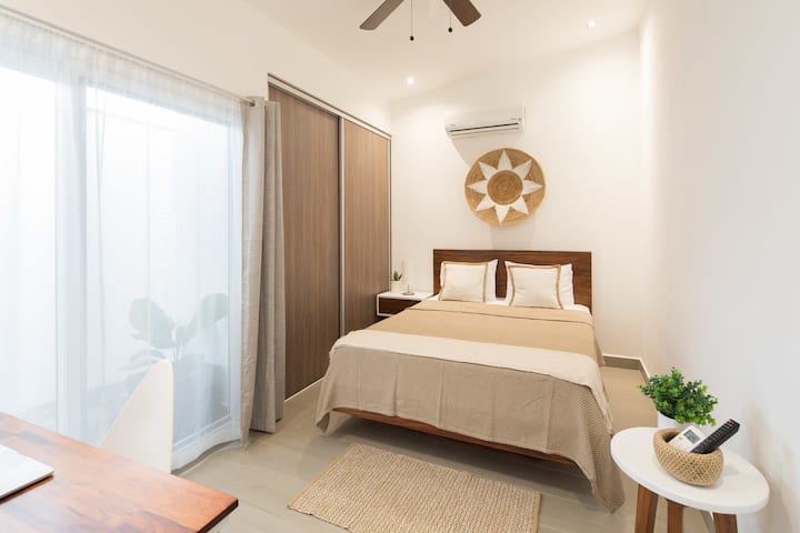 Guest room 2 has a queen size bed. 