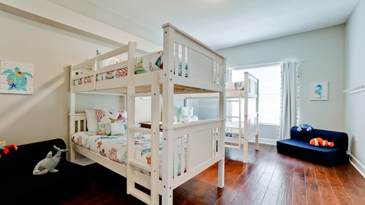 Climb up to dreamland in our bunk bed retreat,  perfect for a restful night's sleep or pillow talk with your bunkmate.