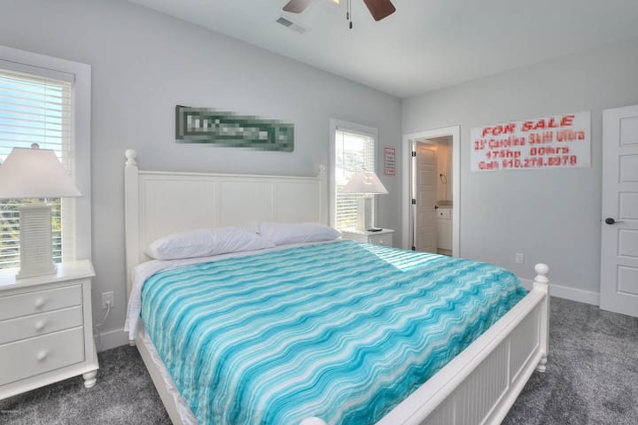 Bedroom #8: home's third primary king suite with attached bath. Shower only, no tub.