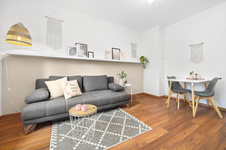 Living room/dining room with sofa as possible further sleeping space for up to 2 people