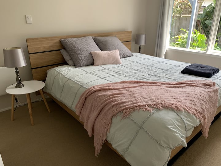The second bedroom is complete with king sized bed, built in wardrobe and a beautiful view of the garden. 