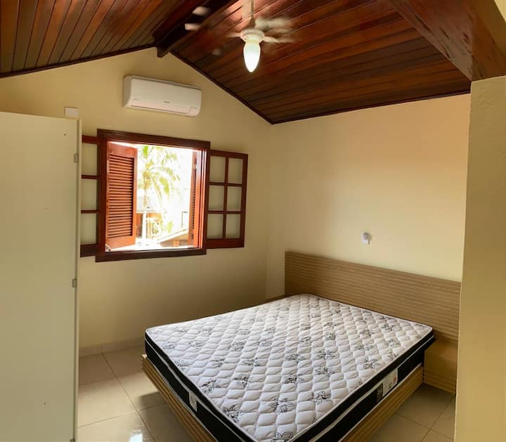 Suite with wardrobes, air-conditioning and queen-size bed.