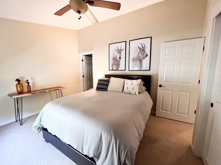 A second bedroom with a queen bed and a private bathroom.