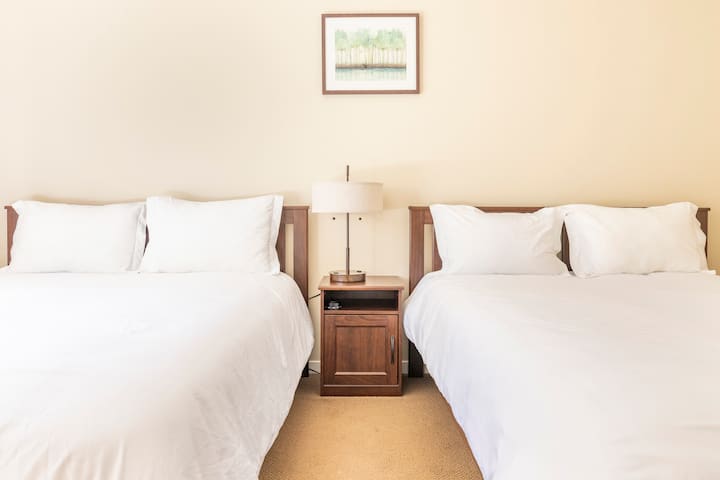 Spacious Guest Bedroom with Two Comfortable Queen Beds for a Relaxing and Restful Stay