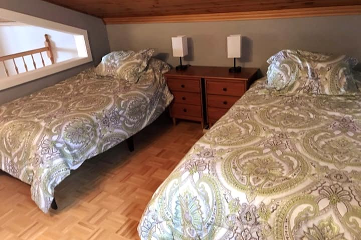Second bedroom on second floor with two twin beds that can be put together.
The angular window opening can be covered.