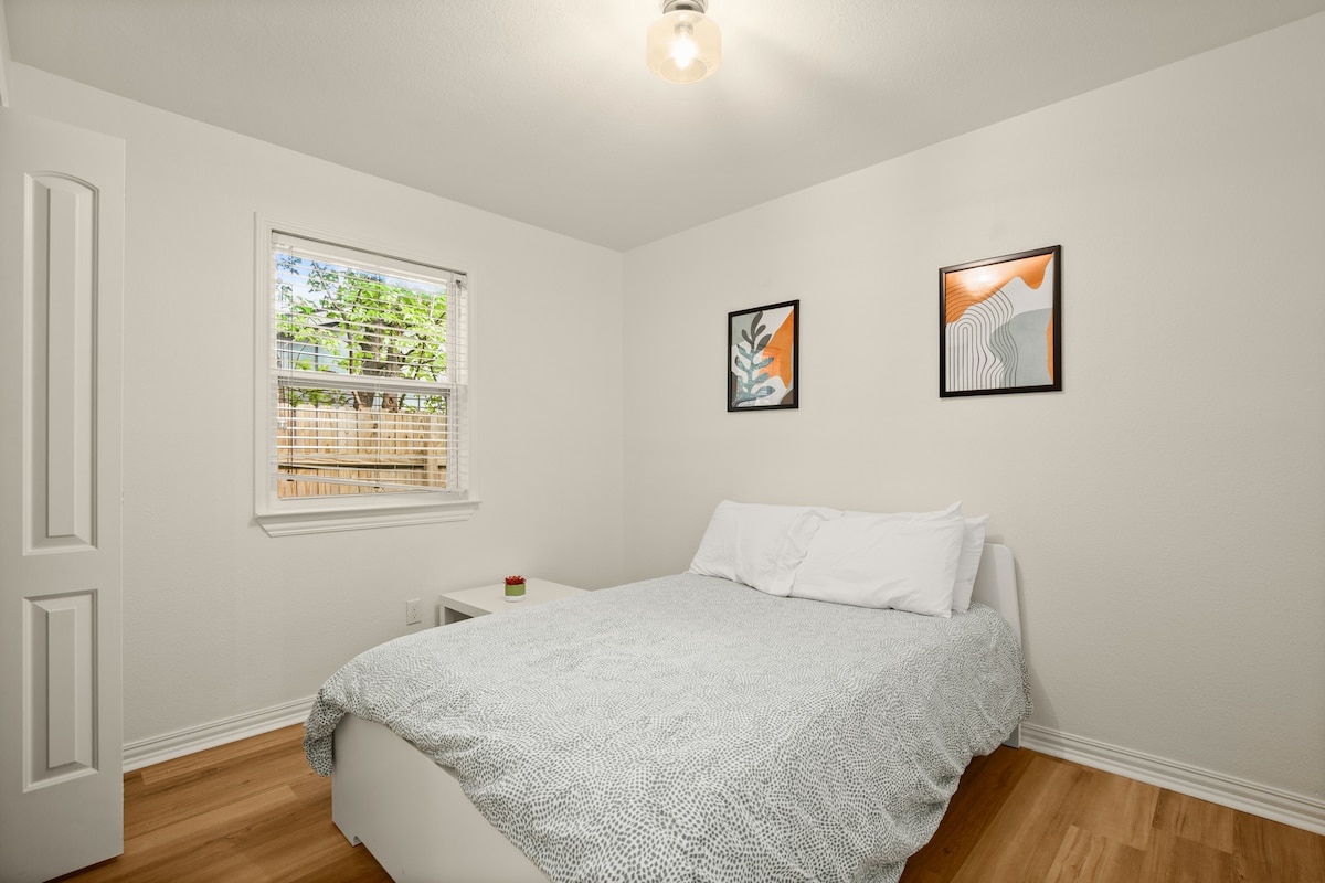 Third Bedroom. Full bed with side table, USB charging lamp, and lots of storage space in the closet 