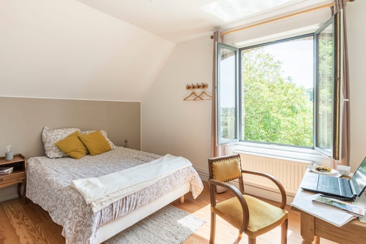 Bedroom 2 "La Chrysalide" on the 1st floor with double bed and orchard view