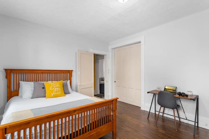 This queen bedroom suite is bright and cheerful, so you’re sure to feel right at home. The dedicated private workspace is perfect for checking in with work during your visit.