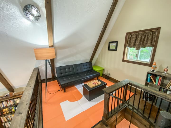 The loft above the living room has a click-clack futon and can serve as a 4th open-air bedroom.