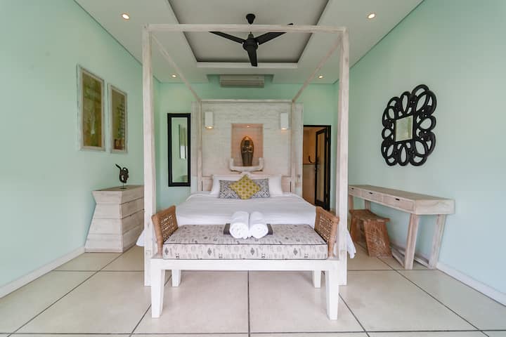 Bright bedroom retreat w/ elegant decor, soft tones & a calm relaxing atmosphere