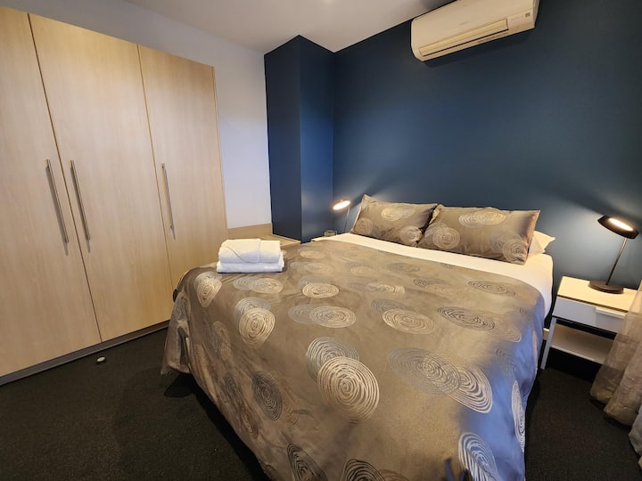 Private queen/twin bedroom with block out curtains.
