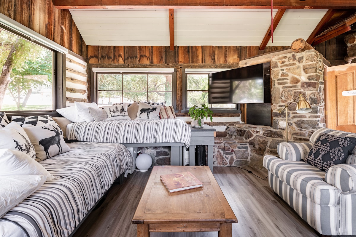 this is the snug den with two twin beds and lots of board games, great for extra guests and late night movies. Heated by an authentic wood burning potbellied stove. 