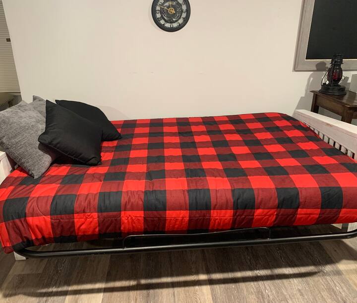 Newly refurbished futon effortlessly pulls out to a full size bed. New mattress on futon.