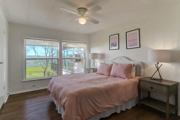 Queen-size bed in the "pink room" with fantastic views of the lake!
