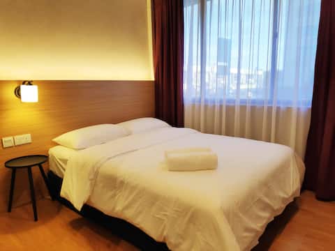EZ Suites Queen bedroom - View of The Mall Gadong