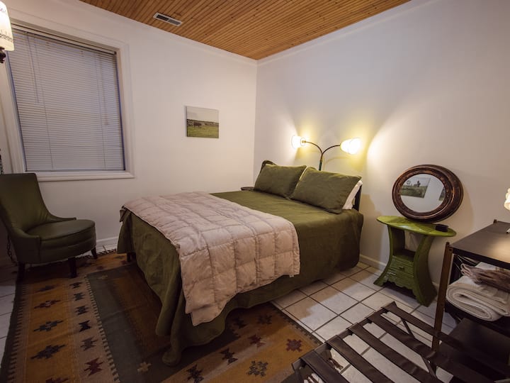 Queen sized memory foam bed in the cozy bedroom. 