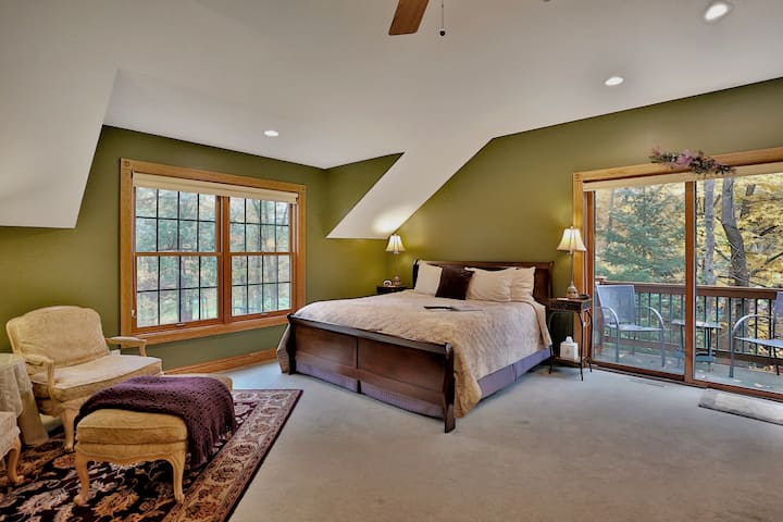 The Royal Fern Room with king-size bed, TV, electric fireplace, comfortable seating and a private deck.