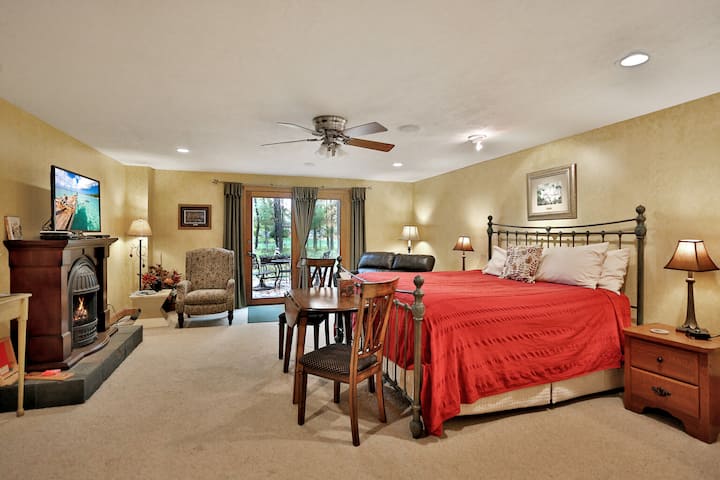 The St. Croix Room, located on the Lower, Walk-out Level.  It has a king-size bed, TV, electric fireplace, comfortable seating and a private patio.