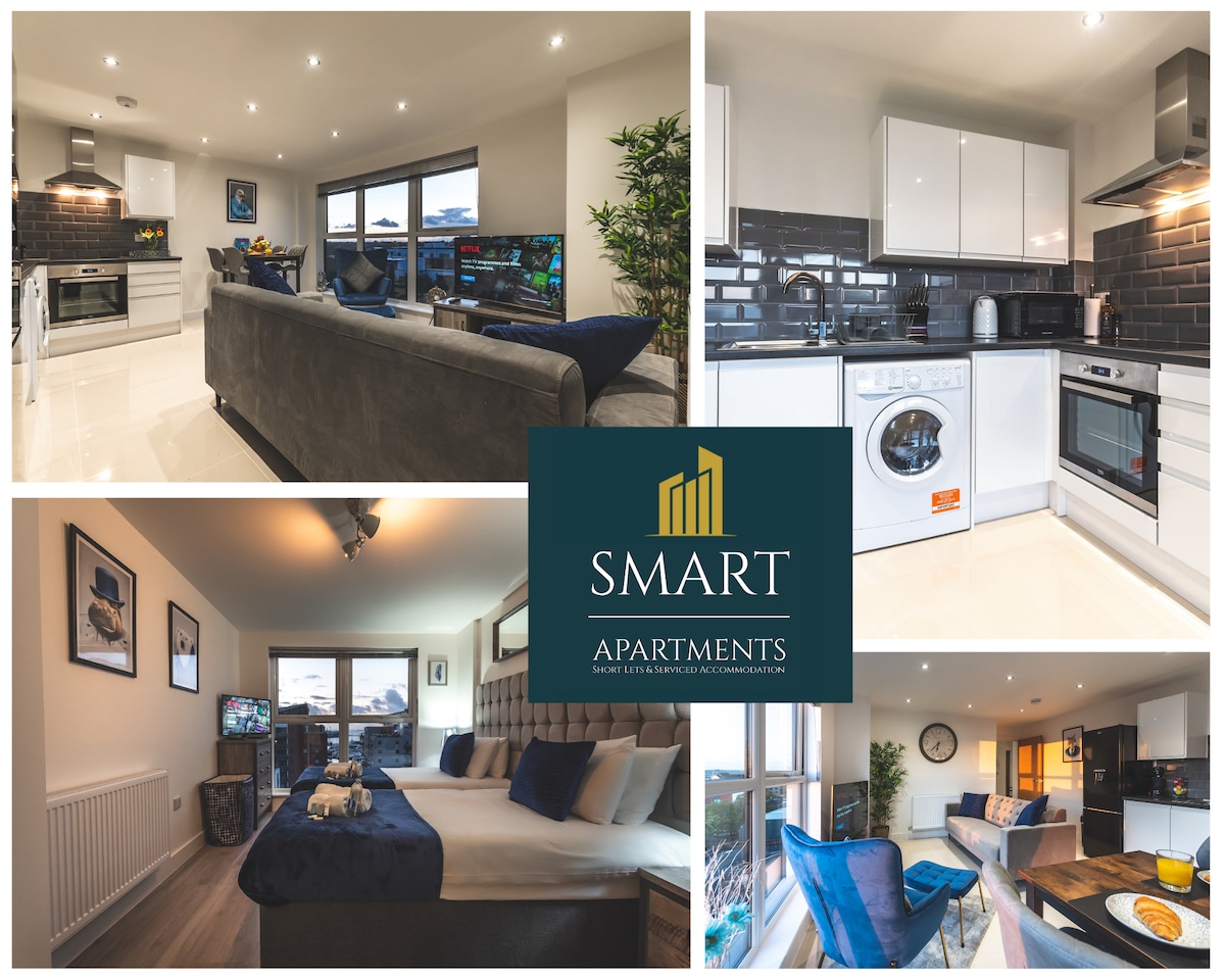 A modern apartment interior features an open living area with a comfortable seating arrangement and a kitchen equipped with contemporary appliances. Two bedrooms are visible, each designed for relaxation. Large windows allow natural light to fill the spaces, enhancing the inviting atmosphere.