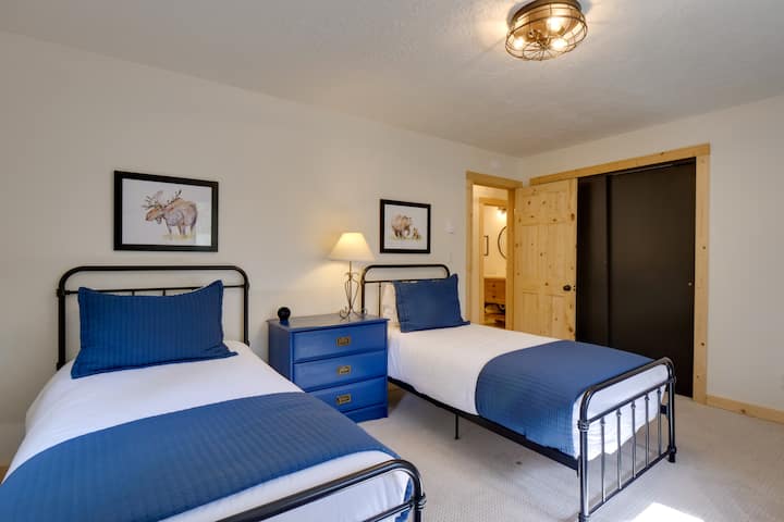 The second upstairs bedroom has two twin beds. This is also where you'll find the Pack N Play, high chair, and booster seat!