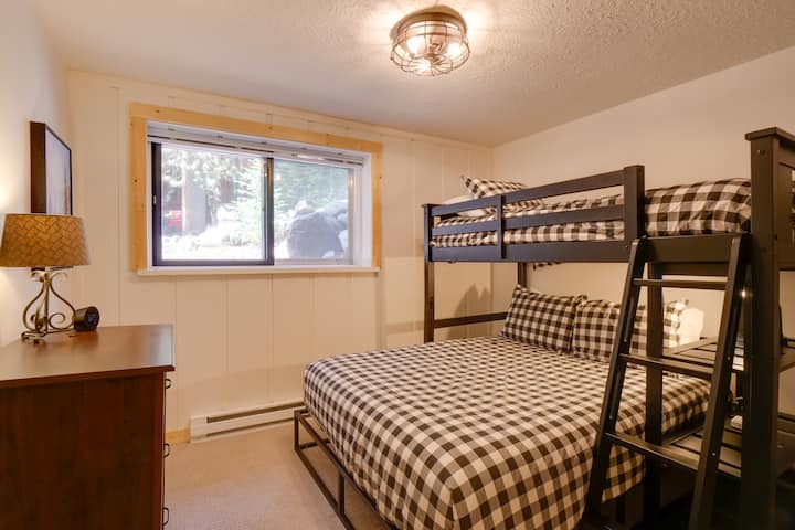 The second bedroom downstairs has a queen bed and a twin bunk. 