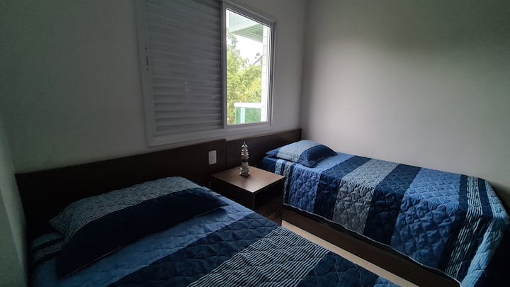 Bedroom 2: It contains a single bed, a trundle bed and 2 separate mattresses.