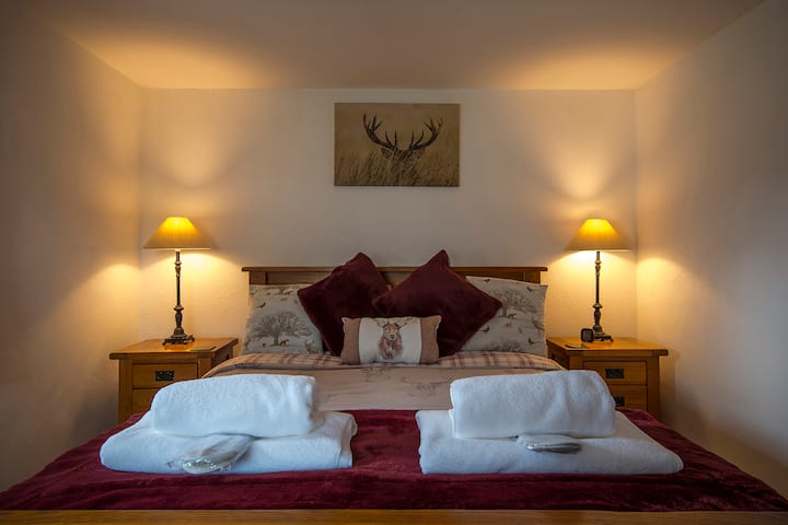 The bedroom has a comfortable king size bed and a cosy feel