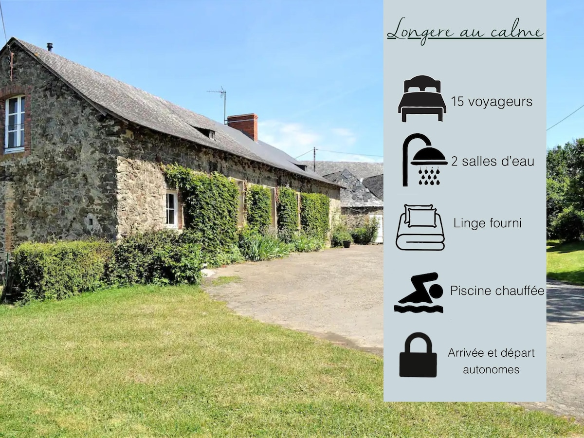 A spacious countryside stone house is set within a peaceful environment. The exterior features lush greenery and ample outdoor space. Essential amenities and a heated pool are indicated nearby, providing comfort for groups and families. The property offers a serene retreat for guests.