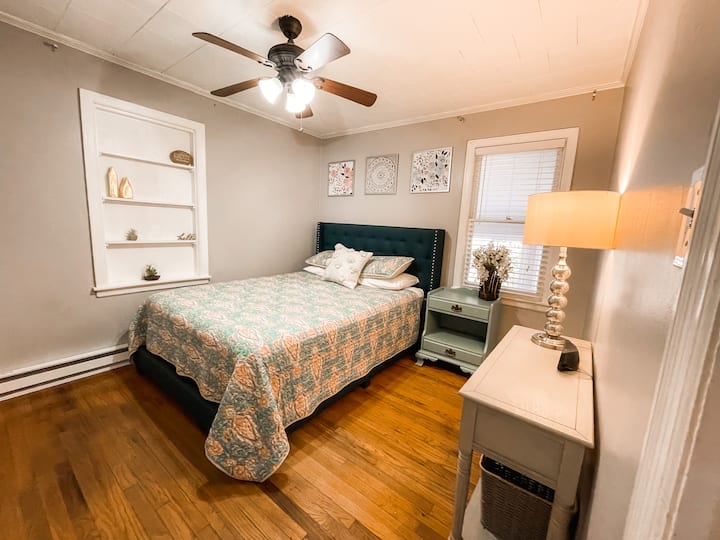 Bedroom 2 ( Queen bed with ceiling fan, storage, hangers and extra blankets.