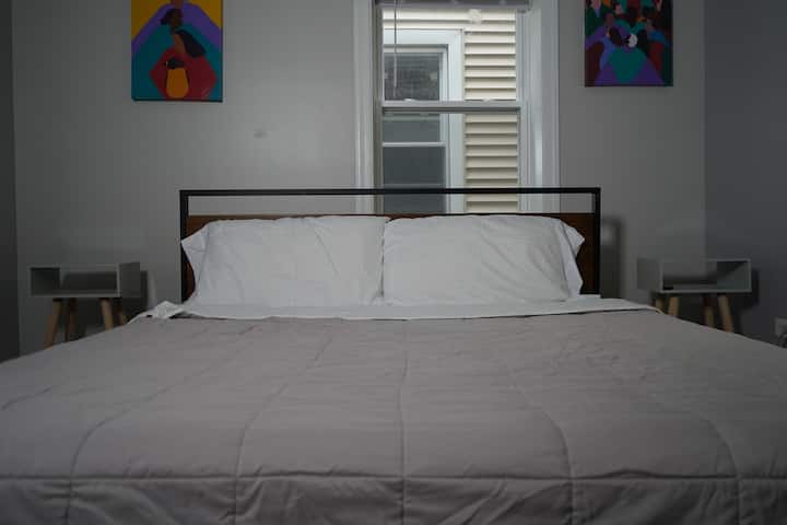 The master bedroom includes a comfy queen sized bed.