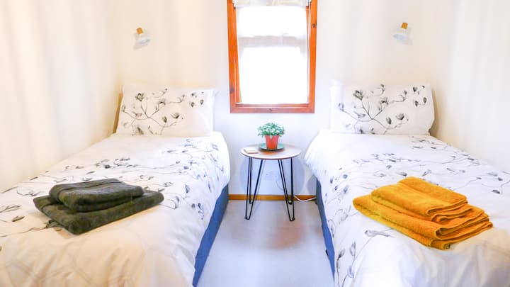 The third bedroom has two single beds that can join together to make a king. It also has a small dressing table with mirror over and a closet with hangers and drawer space.