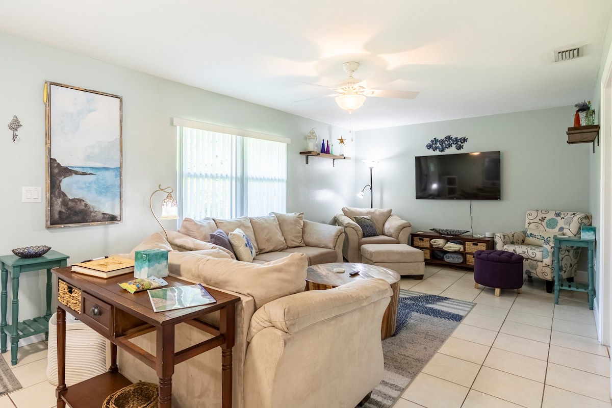The living room has plenty of comfortable space to relax.