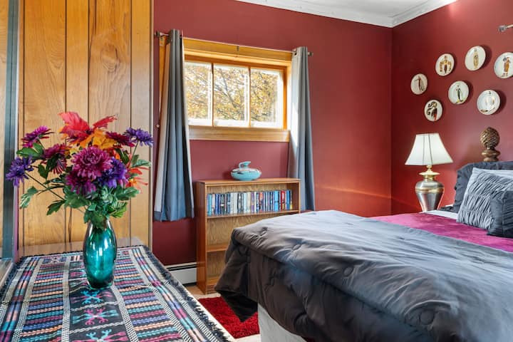 Large downstairs master bedroom with a queen bed.